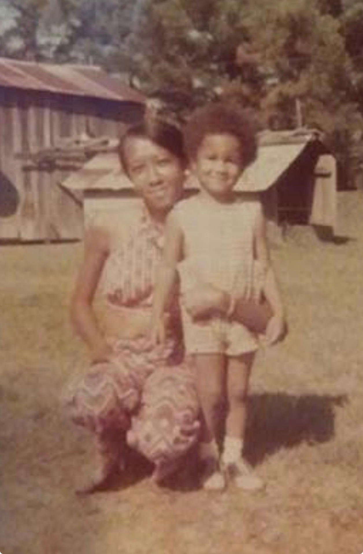 Vintage photo of Knighton mother and child in the yard