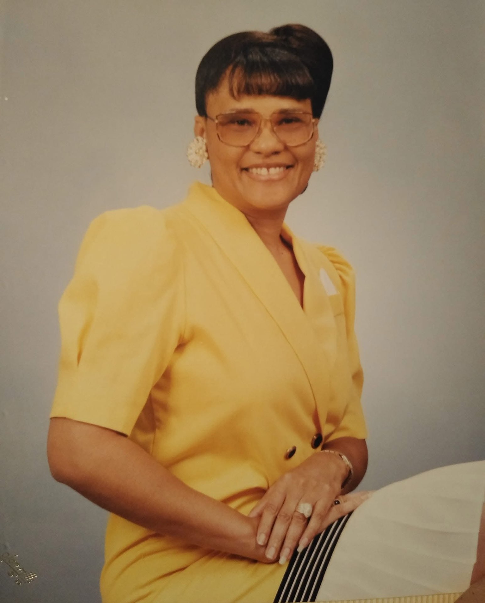 Portrait of a Knighton woman in a yellow dress