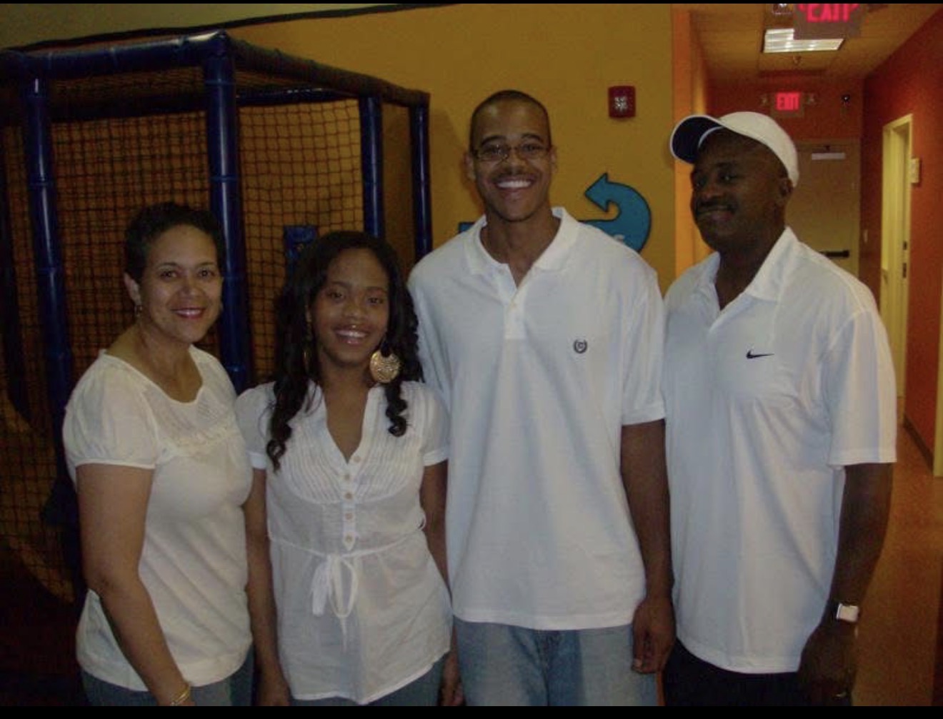 Knighton family of four dressed in white
