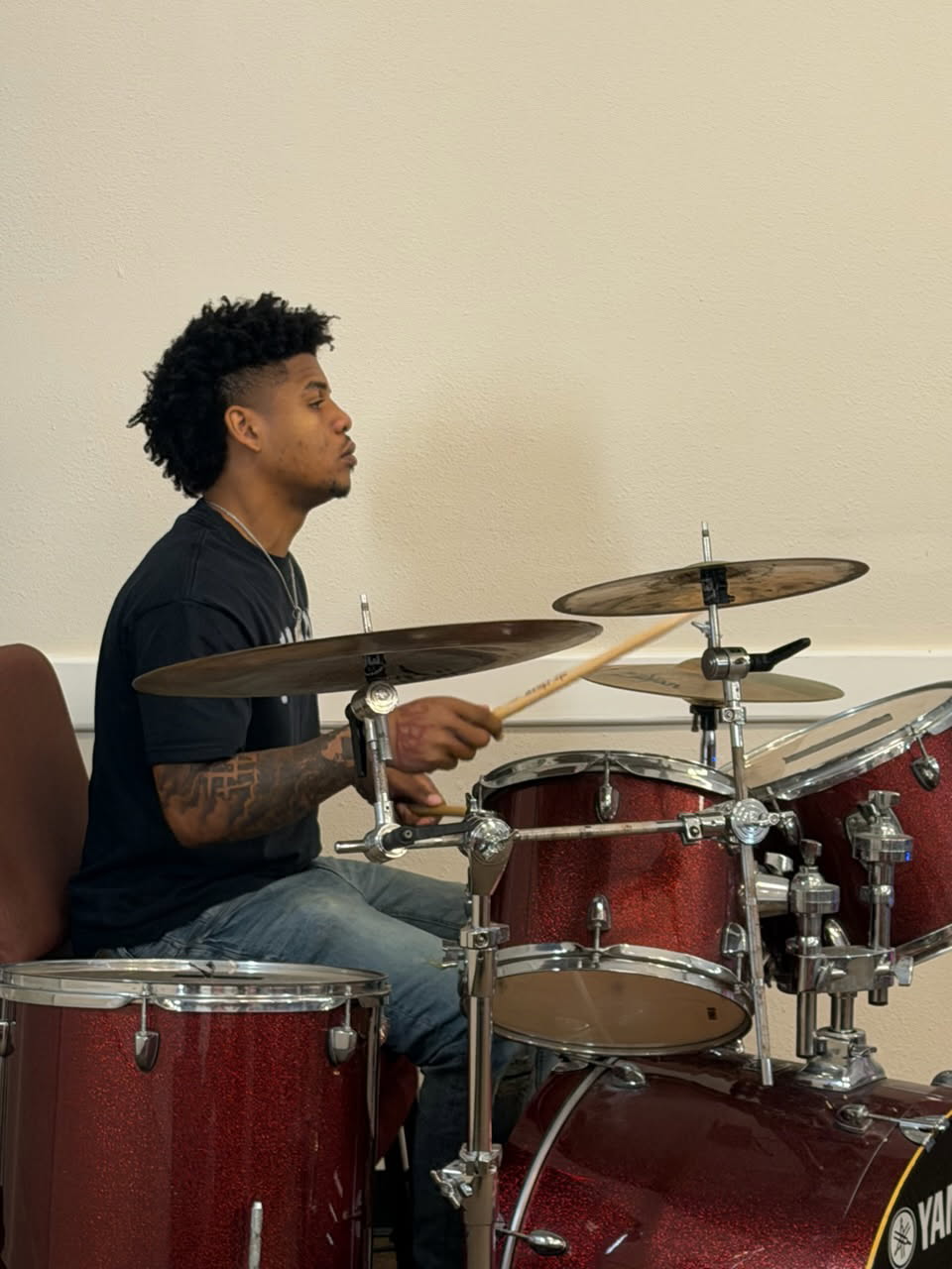 Knighton family member playing the drums