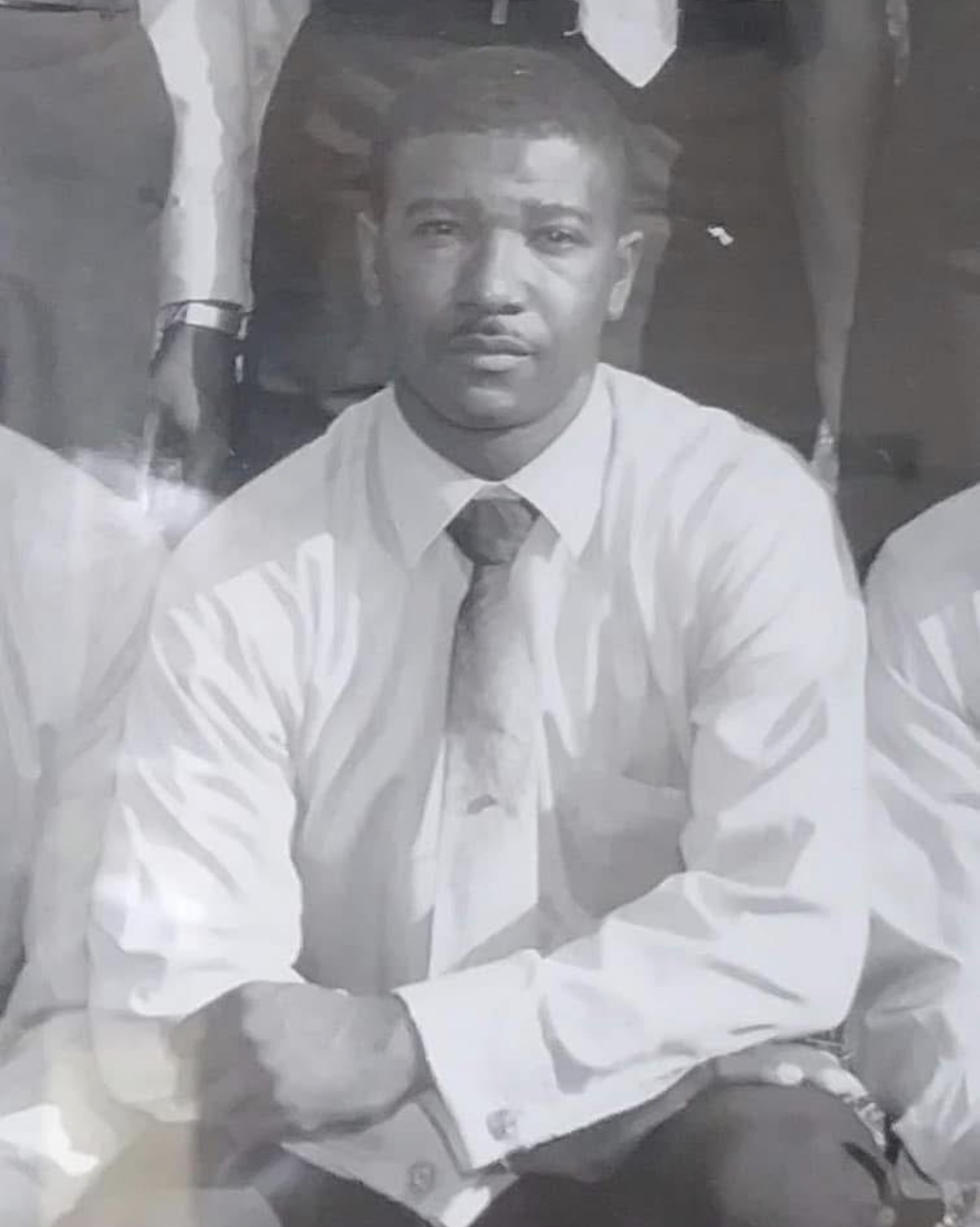 Vintage black-and-white portrait of a Knighton family member in shirt and tie