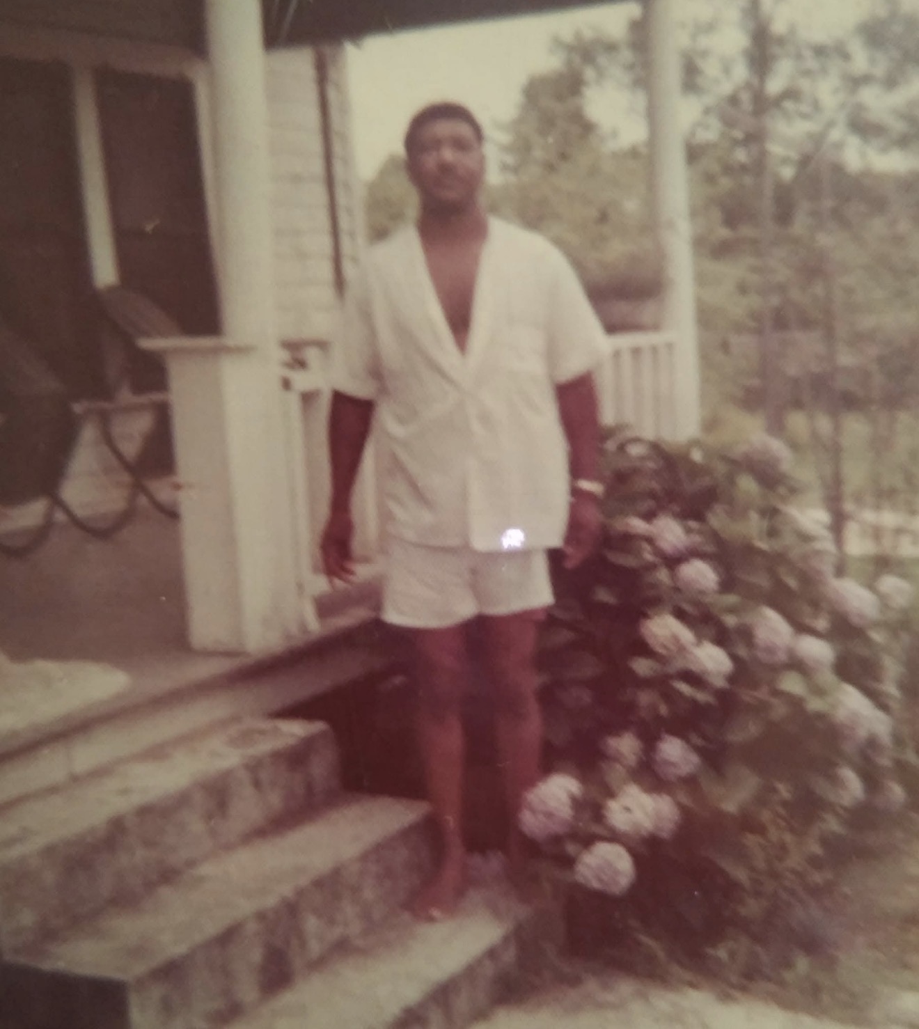 Knighton family member standing on the front porch