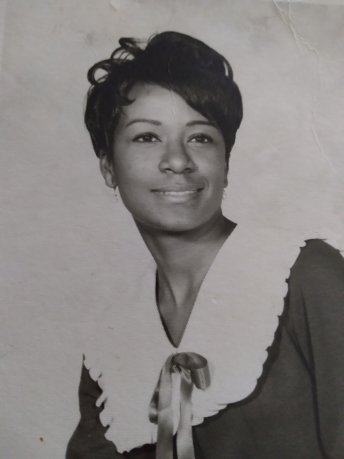 Vintage black-and-white portrait of a Knighton woman with a white collar