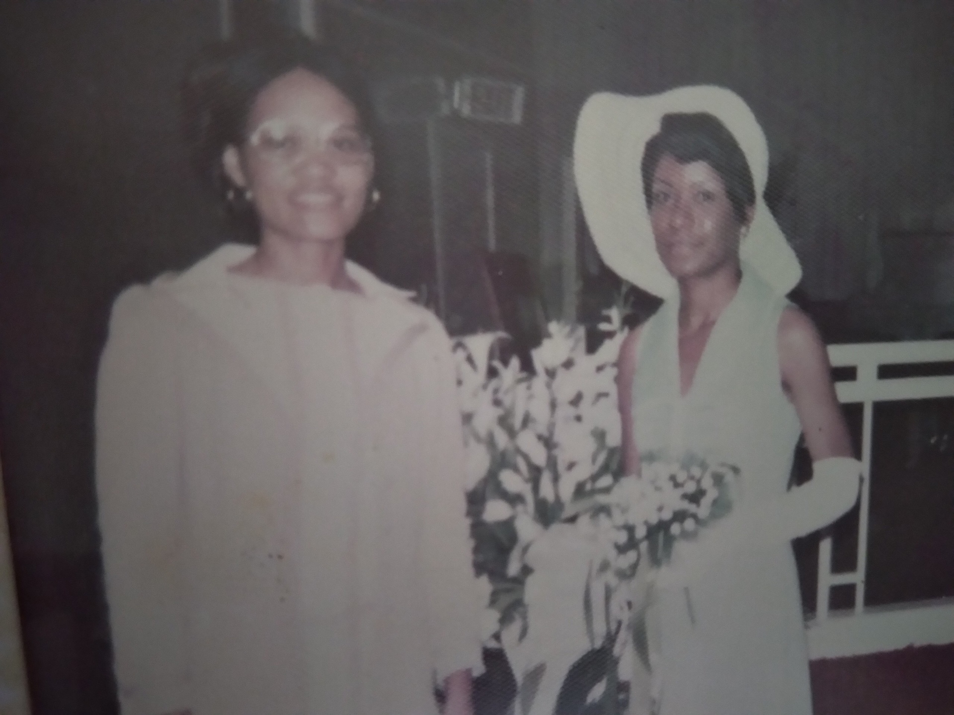 Two Knighton women dressed elegantly with a bouquet