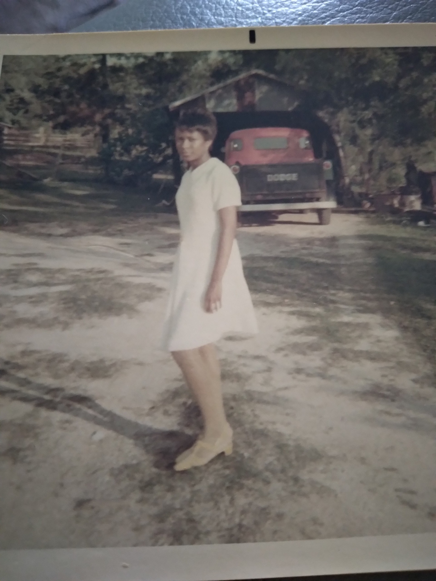 Knighton family member in a white dress outside