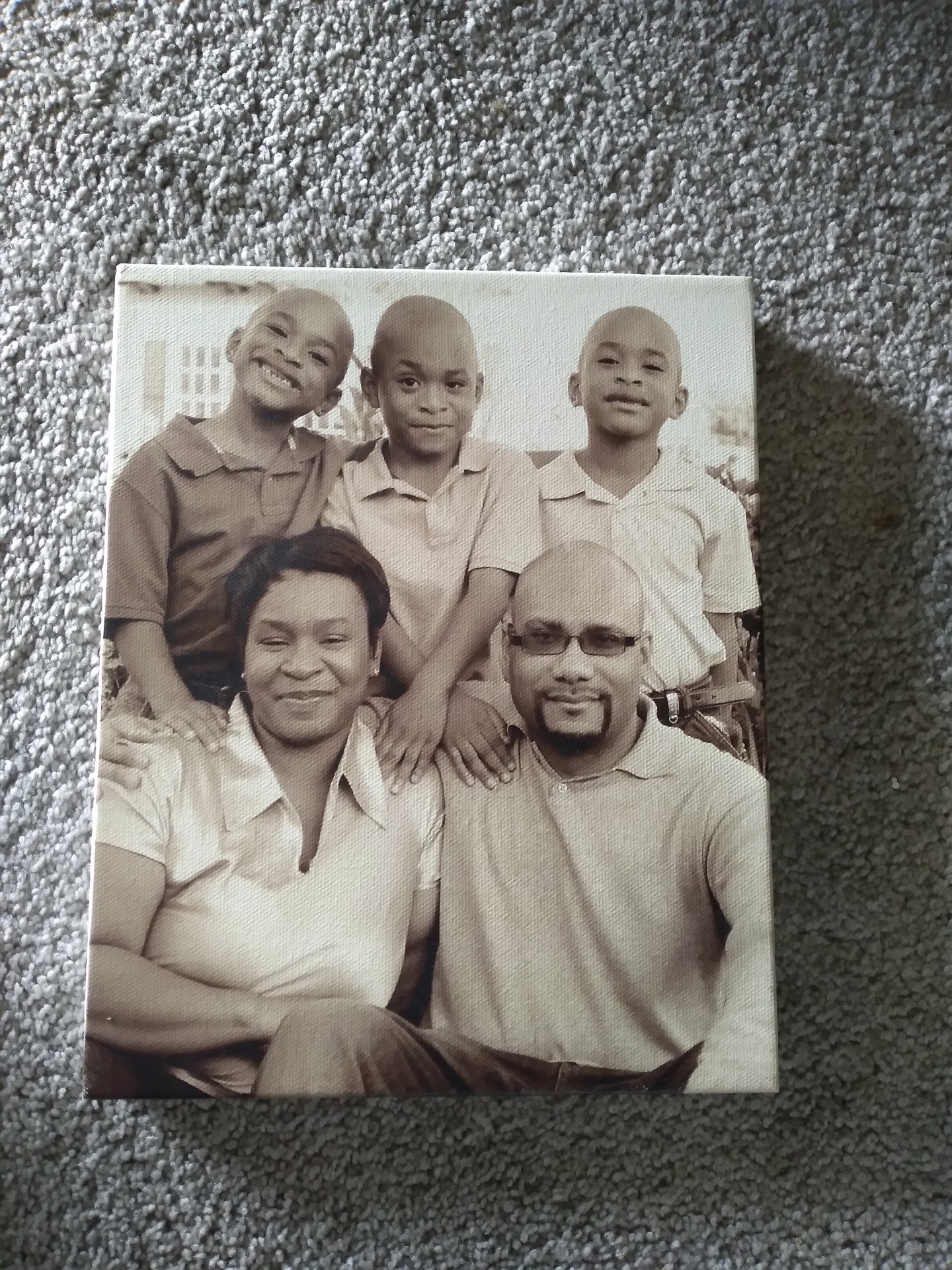 Sepia-toned Knighton family portrait with parents and three sons